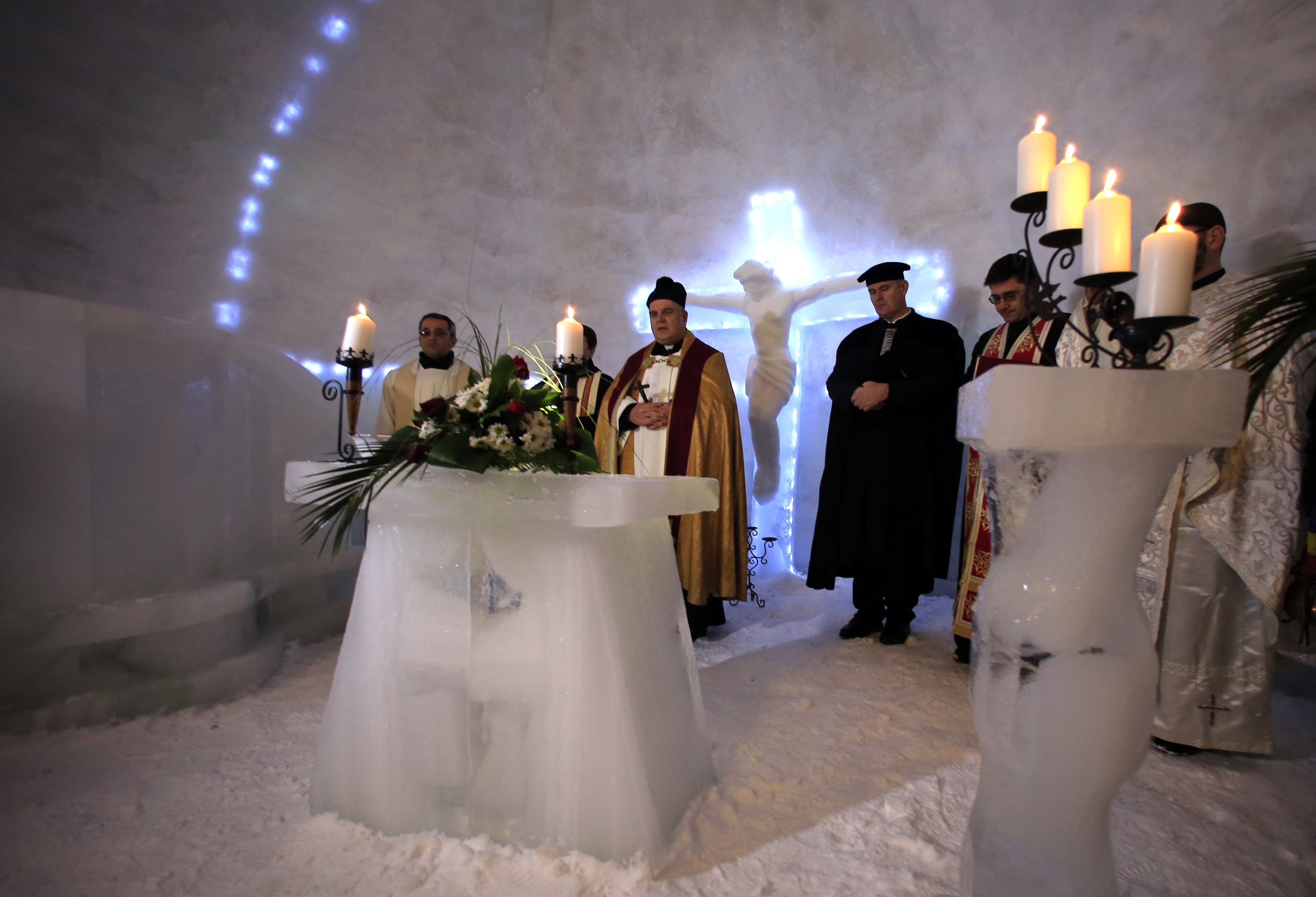 A group of priests of various congregations hold an inaugural mass for a church made entirely from ice at Balea Lac resort. A group of priests of various congregations hold an inaugural mass for a church made entirely from ice at Balea Lac resort.
